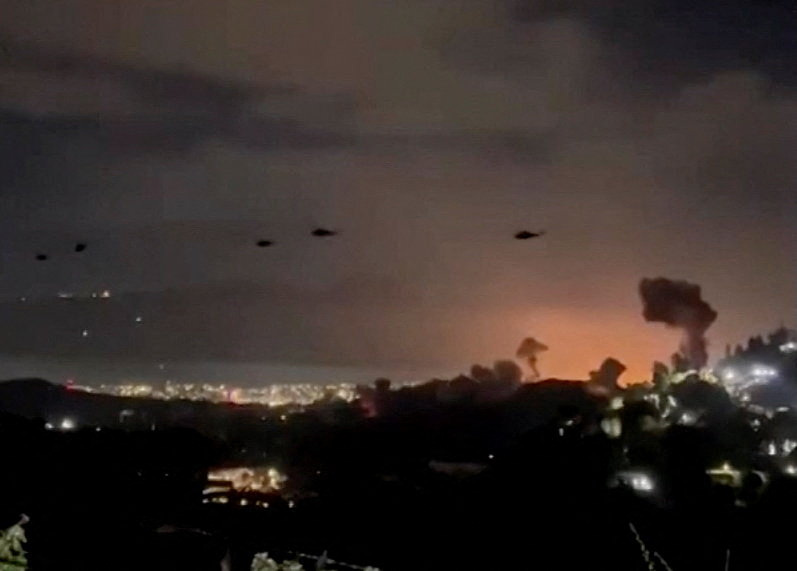 U.S. helicopters fly over Caracas, Venezuela during operation Absolute Resolve
